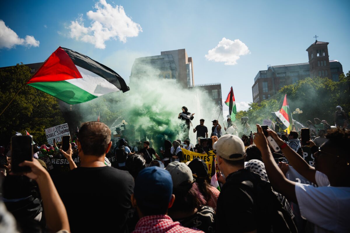 crowd of protesters gathered in Washington Square Park 