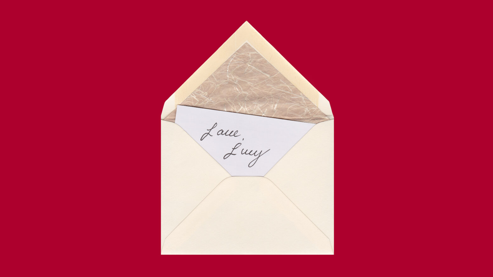 An open envelope sits on a red background with a note inside that reads, “Love, Lucy.”