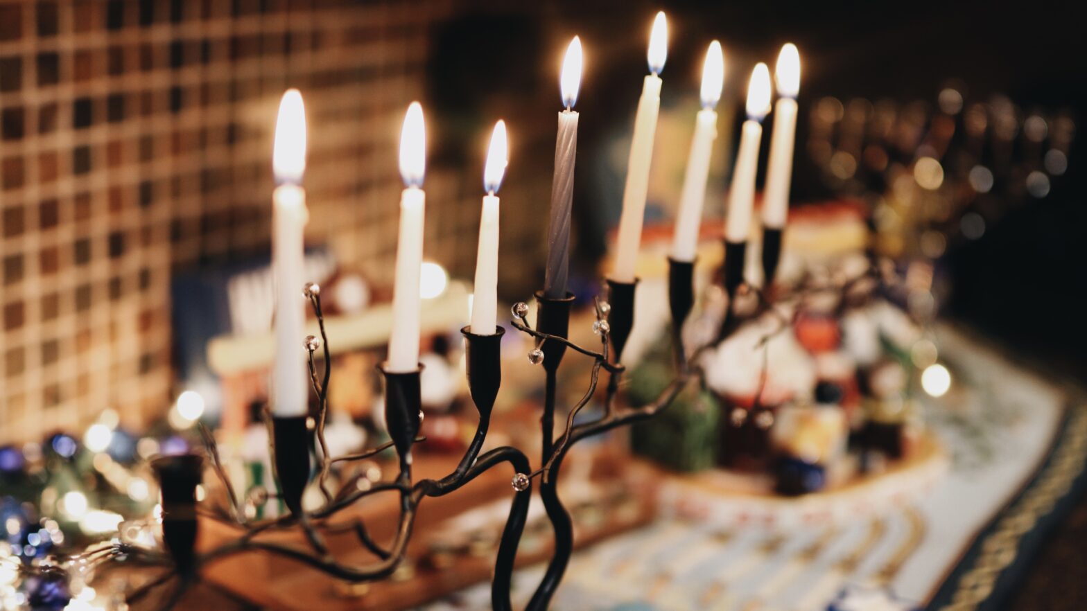 An image of a Menorah with 7 of 8 candles lit.