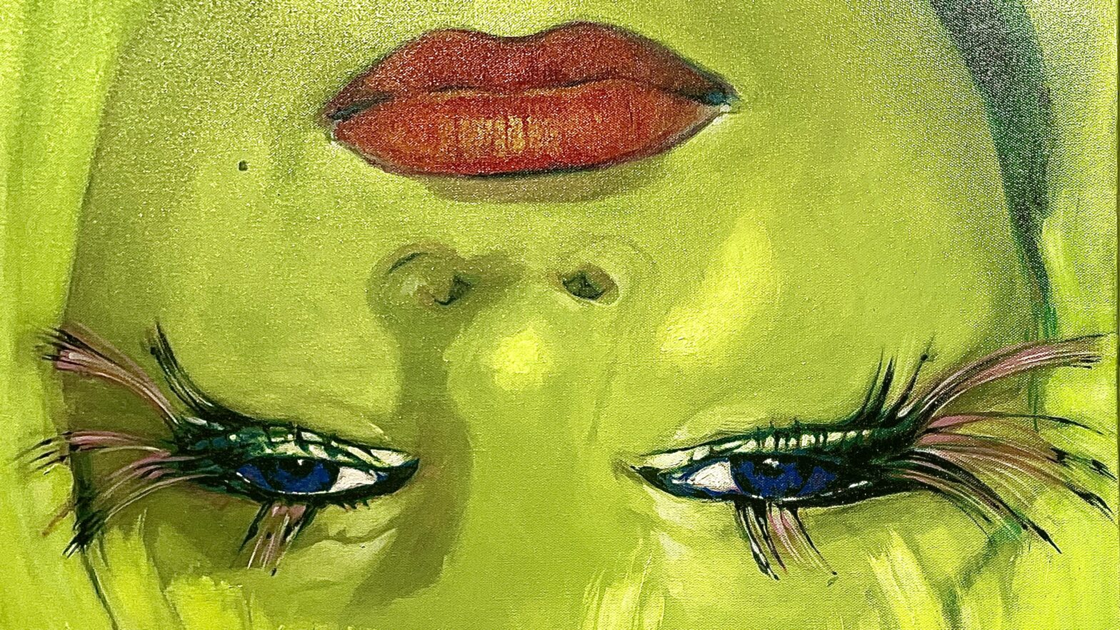 Green painting of a facial outline with emphasized blue eyes and red lips.