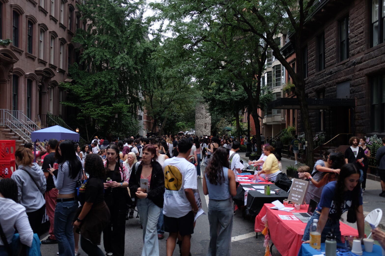 Students walking down 12th Street at the block party.