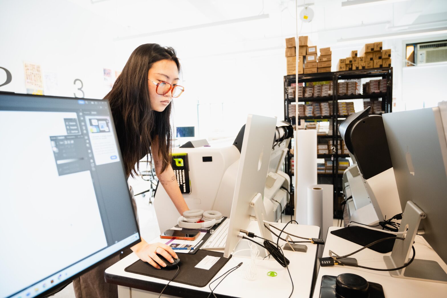 A student on a laptop inside the Making Center.