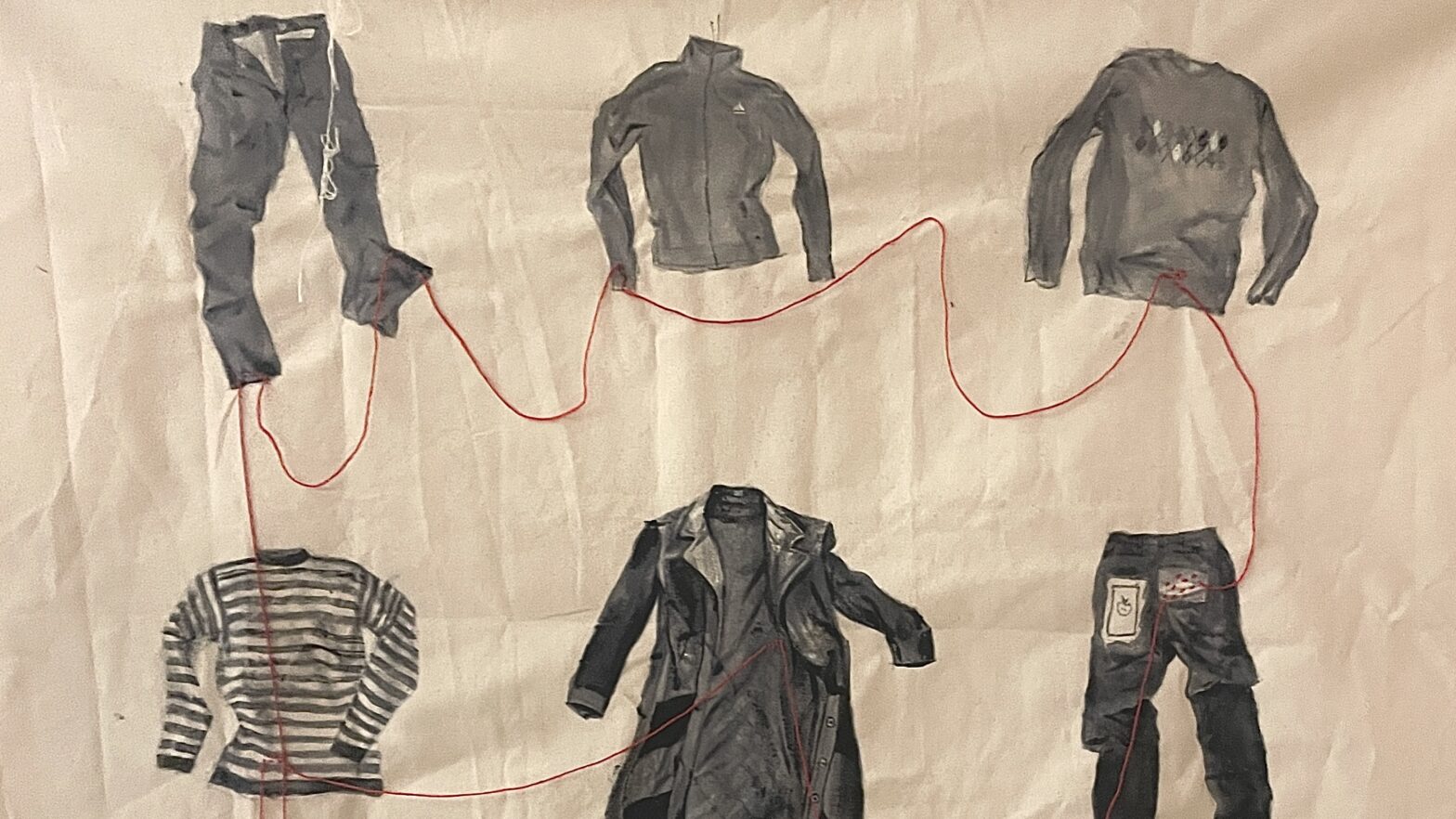 Articles of clothing connected through red thread