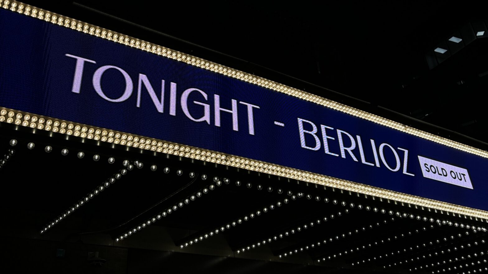 A theatre marquee displaying: “Tonight –- Berlioz, Sold Out”