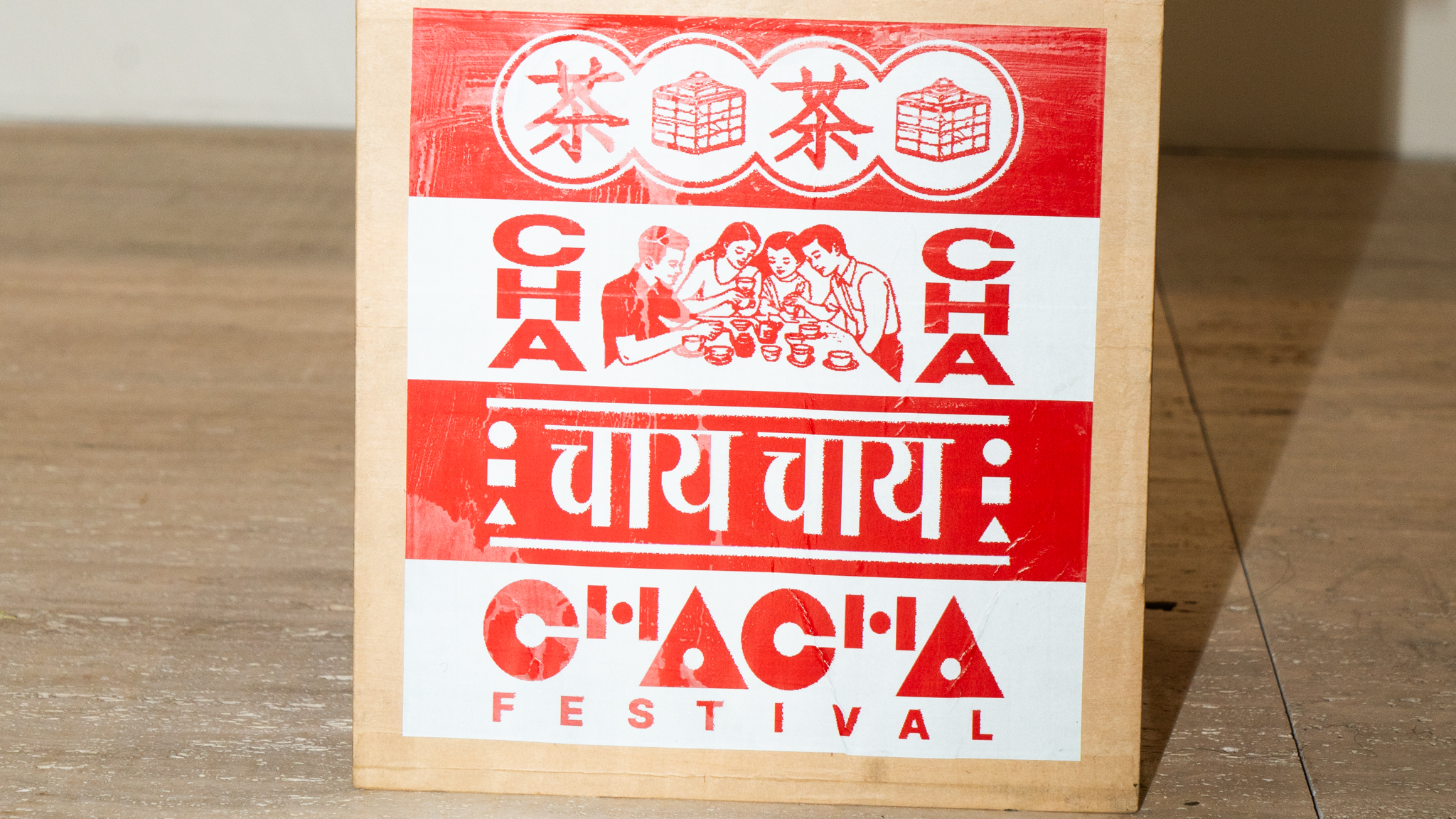 A bright red visual of Cha Cha festival of various typography, lettering form, and geometric shapes.