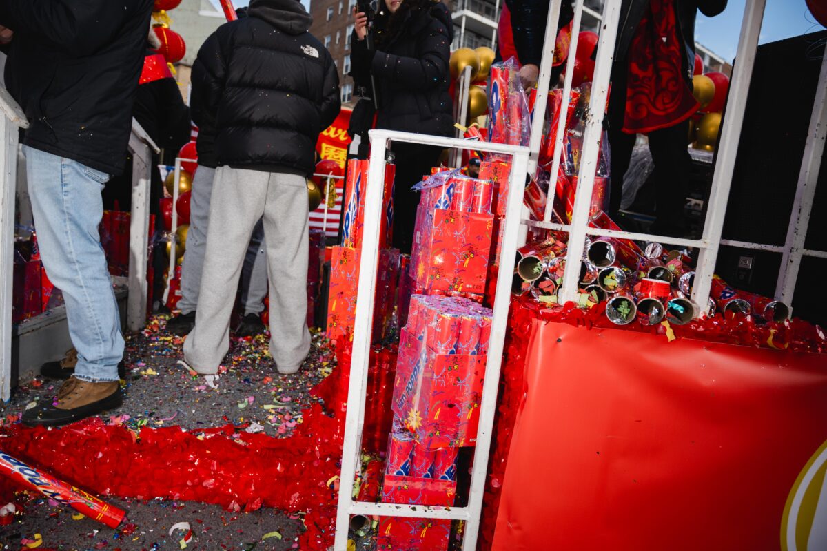 Packages of confetti cannons stacked next to an already-used pile.