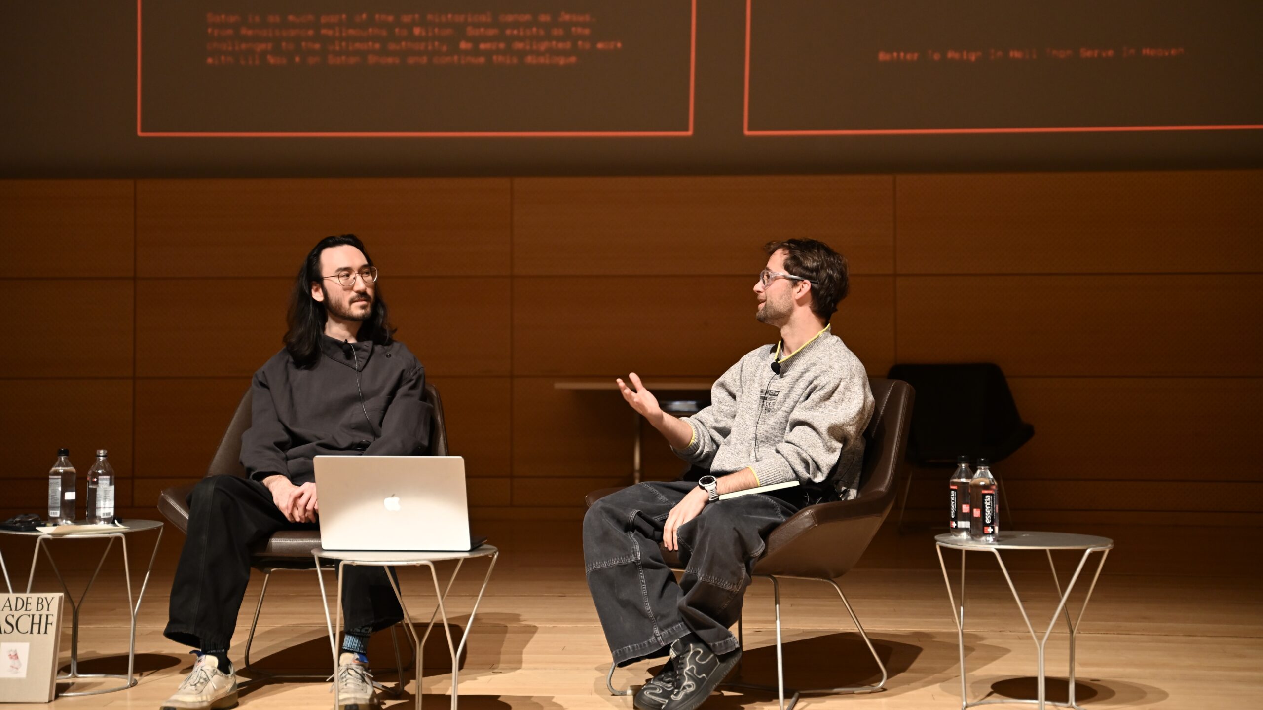 Co-founders of MSCHF, Lukas Bentel and Kevin Wiesner, are seen in the middle of a discussion, during the panel.